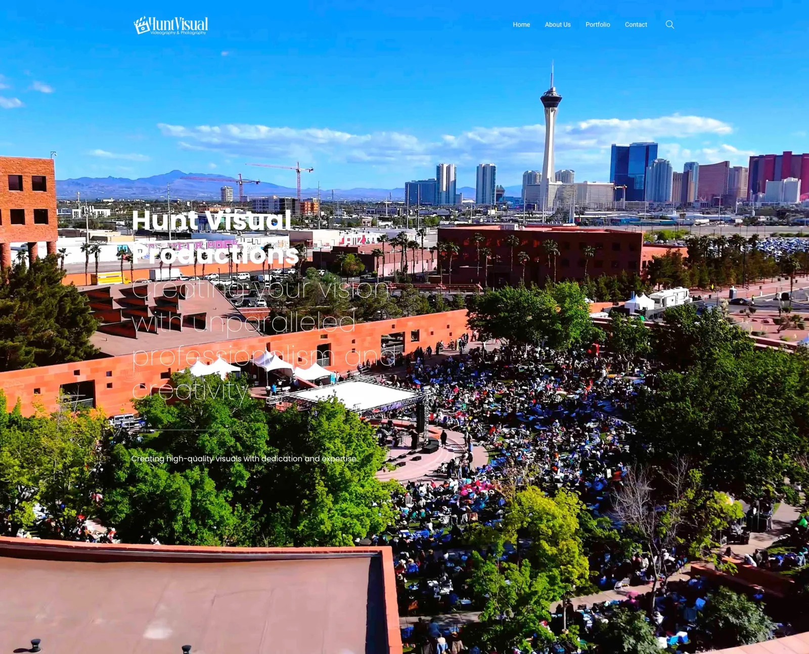 Hunt Visual homepage hero: aerial view of a festival with the city skyline