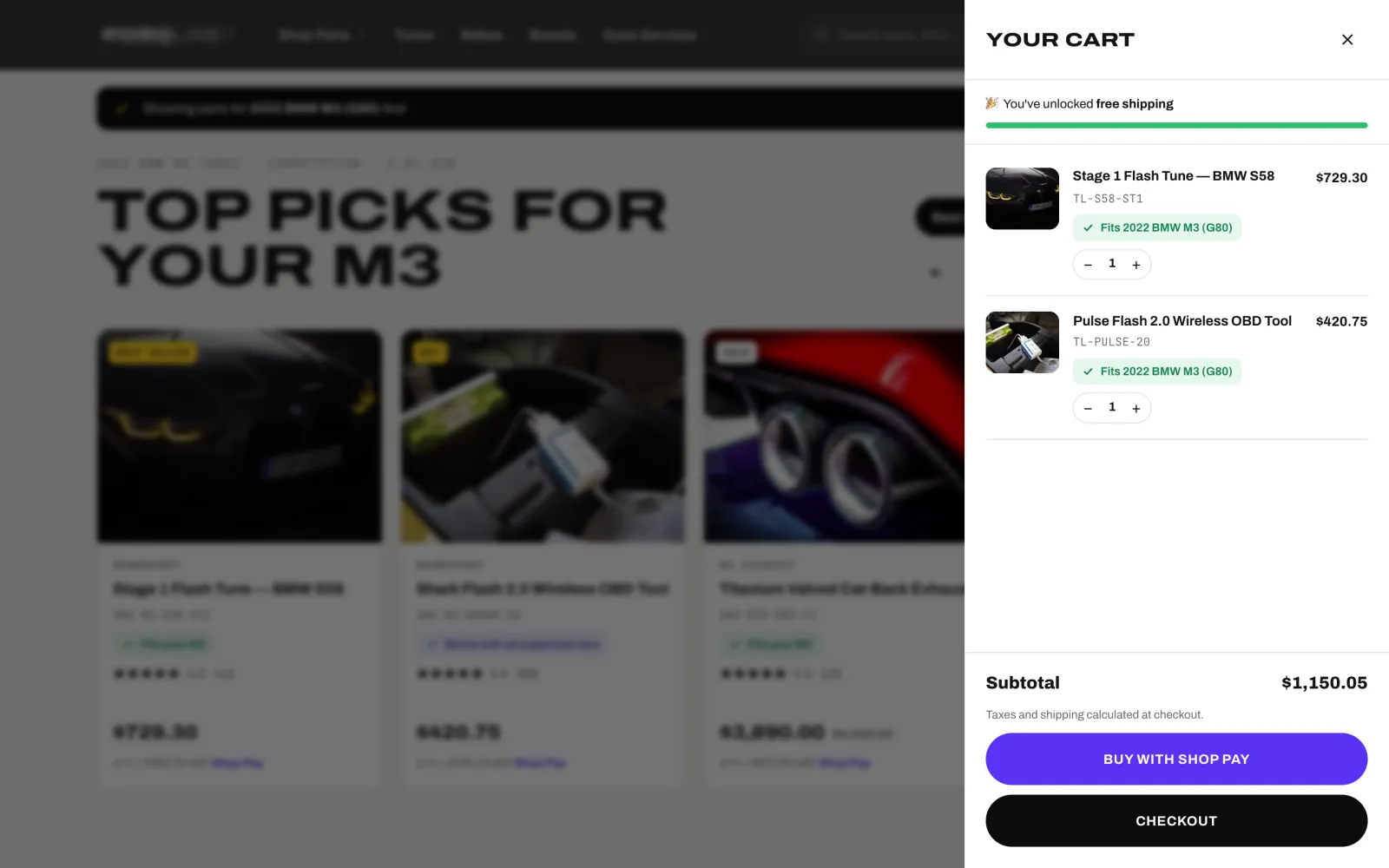 Cart drawer with two items, each confirming it fits the saved car, free shipping unlocked and a Buy with Shop Pay button